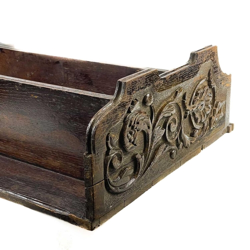 141 - A Victorian oak carved shelf. Wall mounted shelf carved with date 1895 monogram cypher and foliate s... 