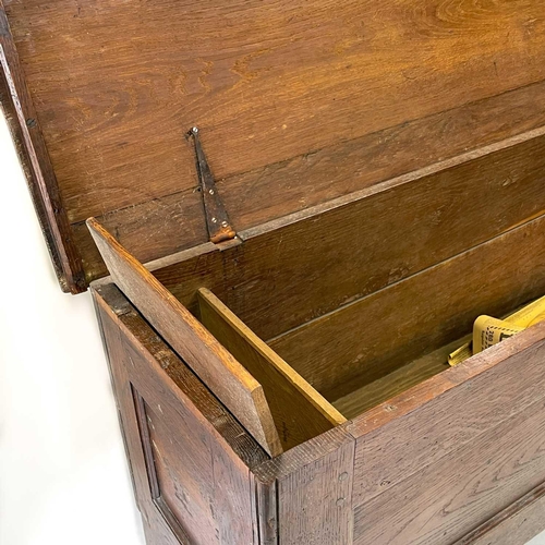 148 - An oak sword chest or kist. Early 18th century, with internal compartment and two panel front, on st... 