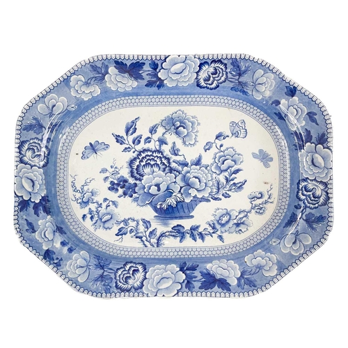 149 - A blue and white pearlware meat platter. Circa 1840, printed with butterflies and an urn of flowers,... 