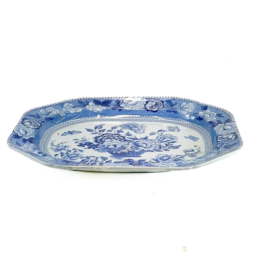 149 - A blue and white pearlware meat platter. Circa 1840, printed with butterflies and an urn of flowers,... 