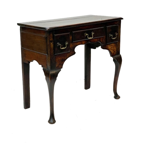 160 - A George III fruitwood low boy. Fitted three drawers, on cabriole legs, height 70cm, width 76.5cm, d... 