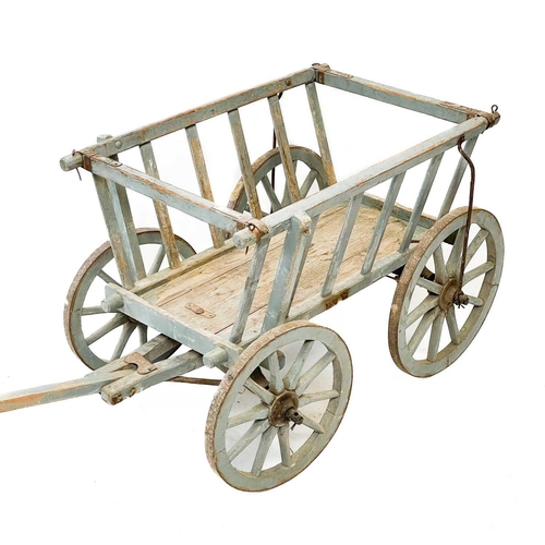 17 - A painted pine dog cart. With slatted tapered sides and iron clad wheels, height 59cm, length (exclu... 