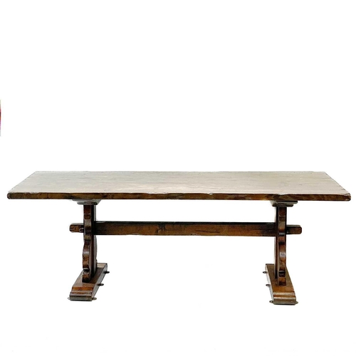 170 - An oak refectory dining table in the 17th century style. Raised on flattened vase shape supports wit... 