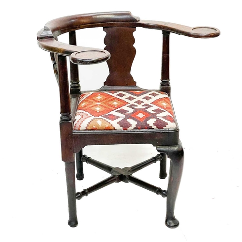 183 - A George II oak corner tub chair. With bow backrest, shaped splats two recessed holders on cabriole ... 