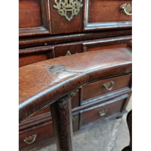 183 - A George II oak corner tub chair. With bow backrest, shaped splats two recessed holders on cabriole ... 