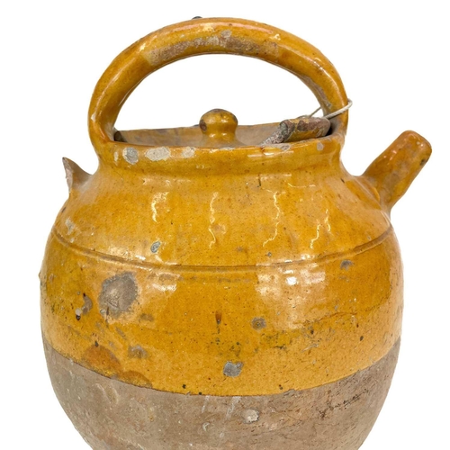 186 - A French pottery Cruche D'eau. Late 19th century with mustard glaze, height 31cm.