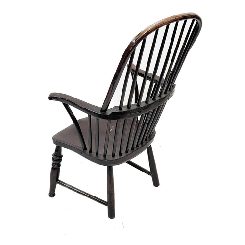 193 - A stained beech kitchen Windsor armchair. 19th century, with a spindle back, on turned legs, height ... 