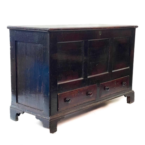 194 - A George III oak mule chest. With a triple panel front above two drawers, on bracket feet, height 85... 