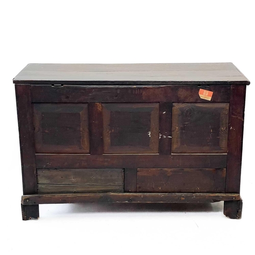 194 - A George III oak mule chest. With a triple panel front above two drawers, on bracket feet, height 85... 