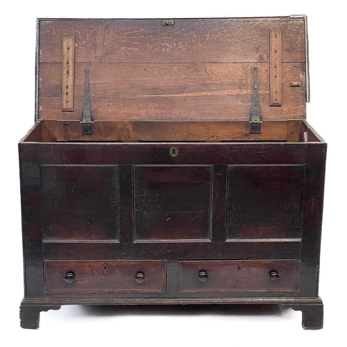 194 - A George III oak mule chest. With a triple panel front above two drawers, on bracket feet, height 85... 