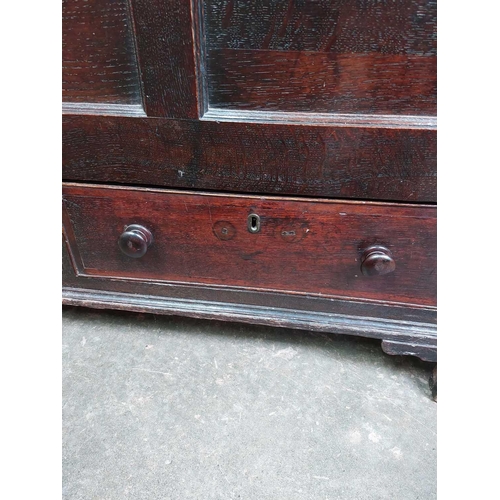 194 - A George III oak mule chest. With a triple panel front above two drawers, on bracket feet, height 85... 