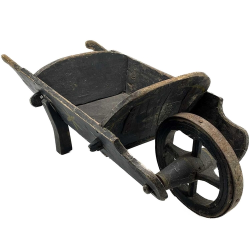 195 - A late Victorian child's painted wheelbarrow. With iron bound wheel, length 82cm, together with a Ge... 