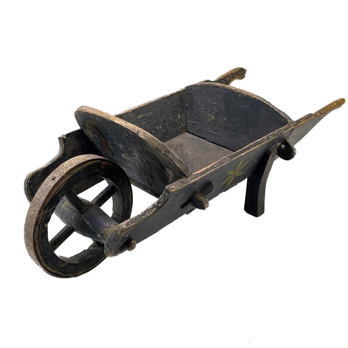 195 - A late Victorian child's painted wheelbarrow. With iron bound wheel, length 82cm, together with a Ge... 