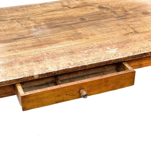 197 - A French farmhouse poplar and fruitwood dining table. 19th century, fitted a single frieze drawer, r... 