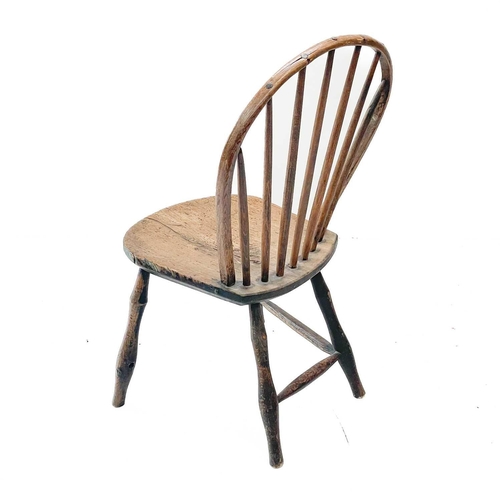 20 - A Yealmpton type Windsor chair. With stick back and solid seat.Evidence of historic woodworm, possib... 