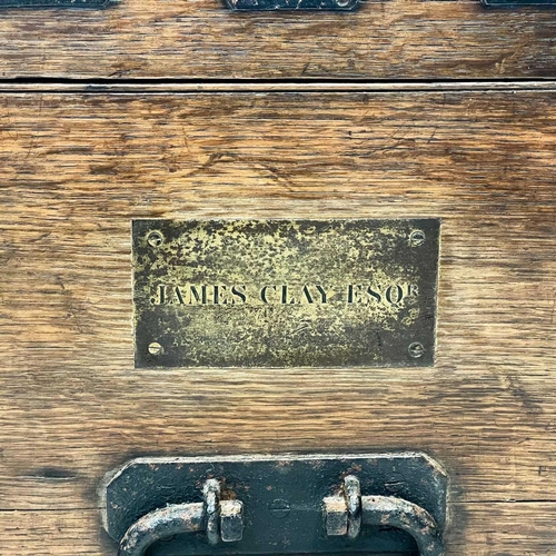 204 - A large Victorian oak dome top silver chest. Ironbound, labelled for Charles Willams, silversmiths, ... 