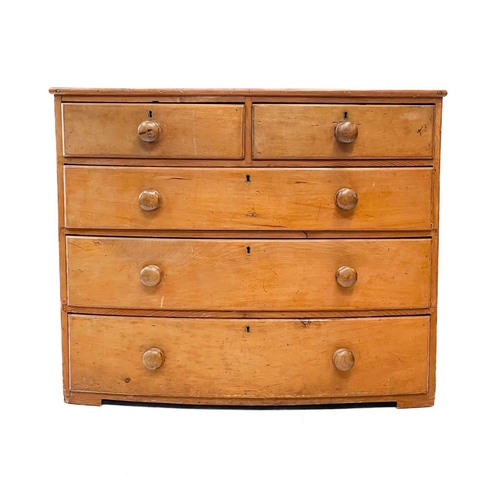 208 - A 19th century pine bow fronted chest of drawers. With two short and three long drawers, height 88cm... 