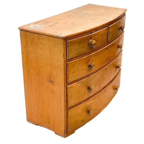 208 - A 19th century pine bow fronted chest of drawers. With two short and three long drawers, height 88cm... 