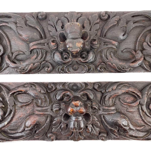 21 - Two carved oak panels. 17th century, carved with lion's masks, eagle heads, fruiting vines and folia... 