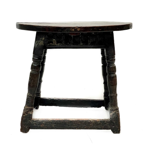 218 - An oak joint stool. Incorporating 17th century elements, now as an occasional table, with an oval el... 