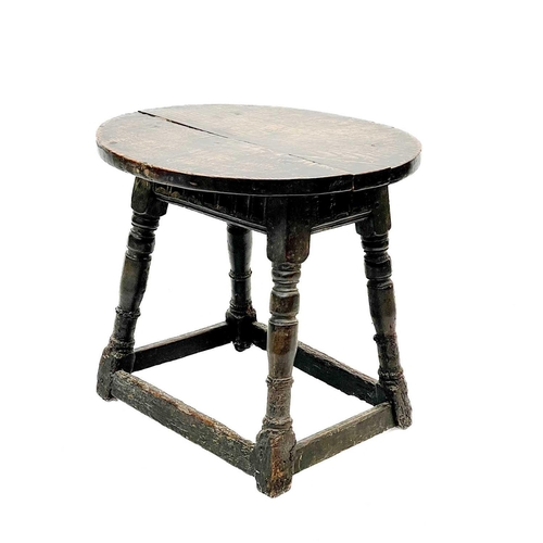 218 - An oak joint stool. Incorporating 17th century elements, now as an occasional table, with an oval el... 