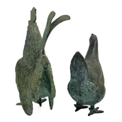 225 - A bronze model of a cockerel. Height 29cm together with a bronze model of a hen. (2)