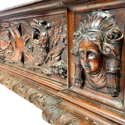 231 - A late 19th century walnut carved cassone. Carved in the Renaissance style the central panel with a ... 