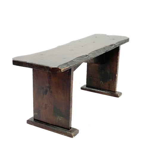 238 - A rustic elm form or bench. Circa 1900, raised on plank end supports, height 41.5cm, width 102cm, de... 