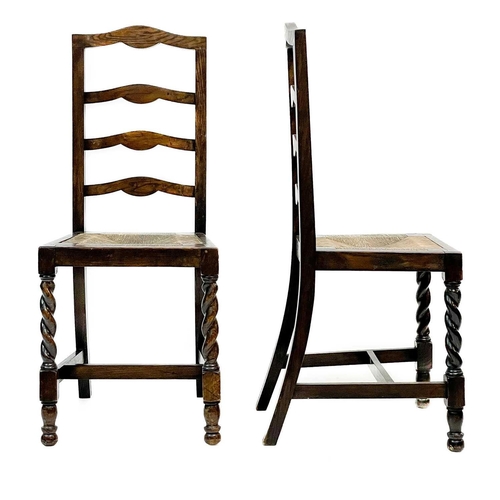 239 - A George III ash and oak country made elbow chair. With slat back and solid plank seat, with a squar... 