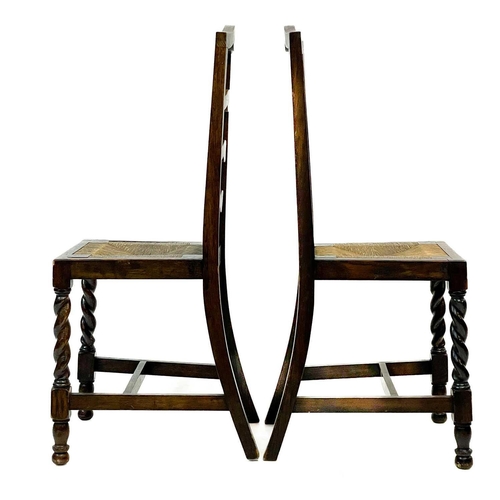 239 - A George III ash and oak country made elbow chair. With slat back and solid plank seat, with a squar... 