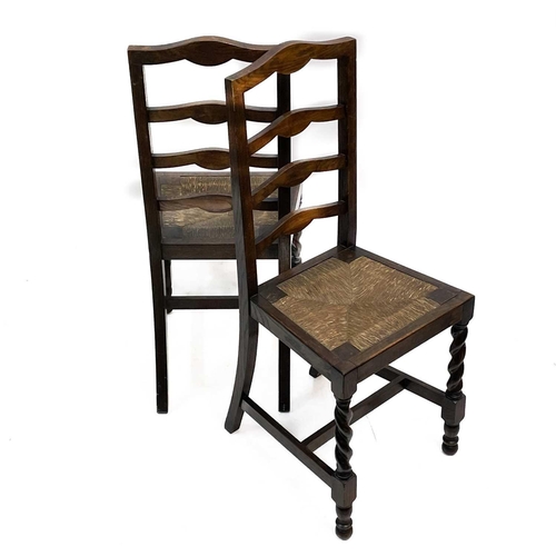 239 - A George III ash and oak country made elbow chair. With slat back and solid plank seat, with a squar... 