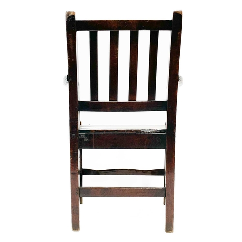 239 - A George III ash and oak country made elbow chair. With slat back and solid plank seat, with a squar... 