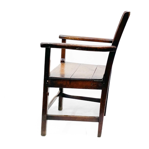 239 - A George III ash and oak country made elbow chair. With slat back and solid plank seat, with a squar... 