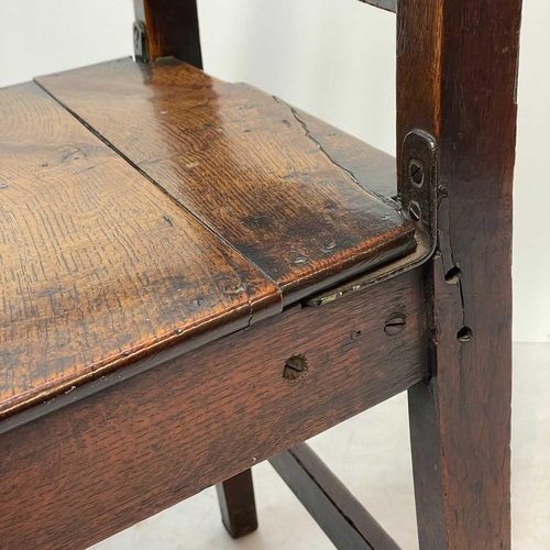 239 - A George III ash and oak country made elbow chair. With slat back and solid plank seat, with a squar... 