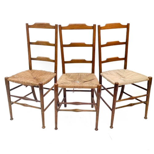 245 - Three Victorian ladderback chairs. One with rush seat, two with cord seats, height 92cm width 40cm d... 