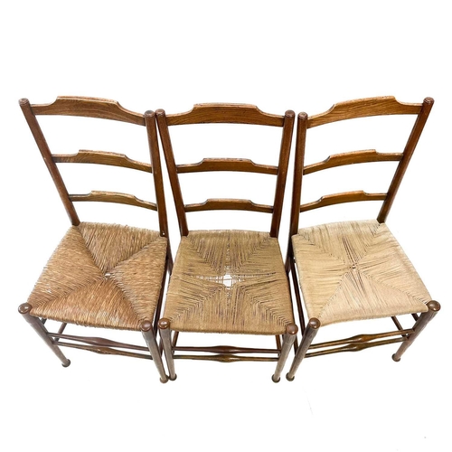 245 - Three Victorian ladderback chairs. One with rush seat, two with cord seats, height 92cm width 40cm d... 