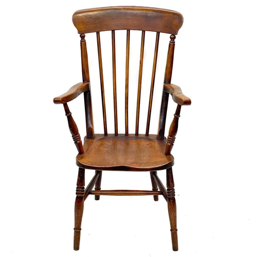 246 - A Victorian beech, ash and elm kitchen Windsor armchair. With spindle turned back, and solid seat, h... 