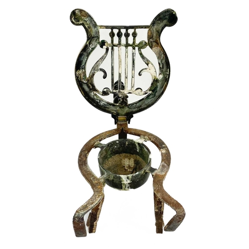 253 - A Victorian Longfields patent brass and steel trivet. With turned ebonised handle and hinged lyre sh... 