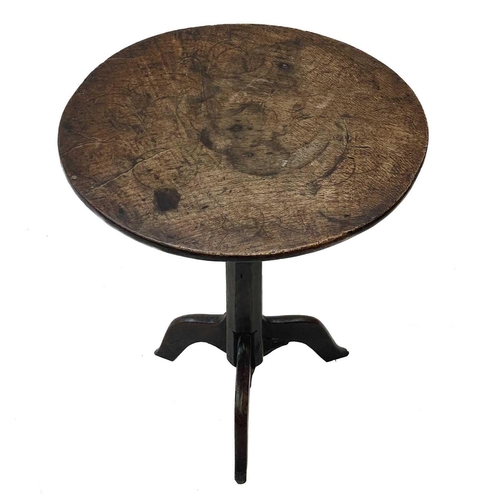 257 - A late Georgian primitive oak circular occasional table. With a figured top, on a chamfered pillar a... 