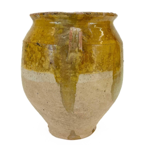 26 - A 19th century French pottery twin handled confit pot. With mustard glaze, height 30cm diameter 21.5... 