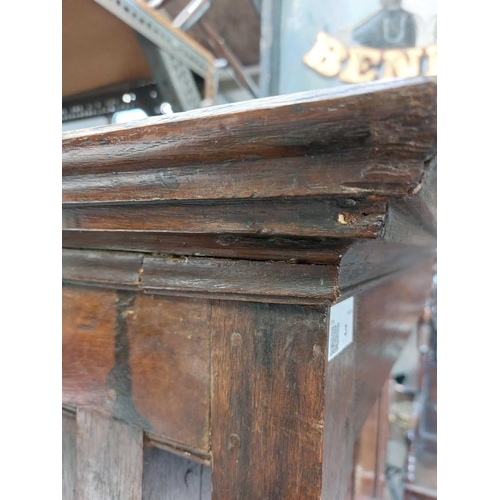 3 - A late George III Welsh oak cupboard Deuddarn The cornice with drop finials above two doors, the pro... 