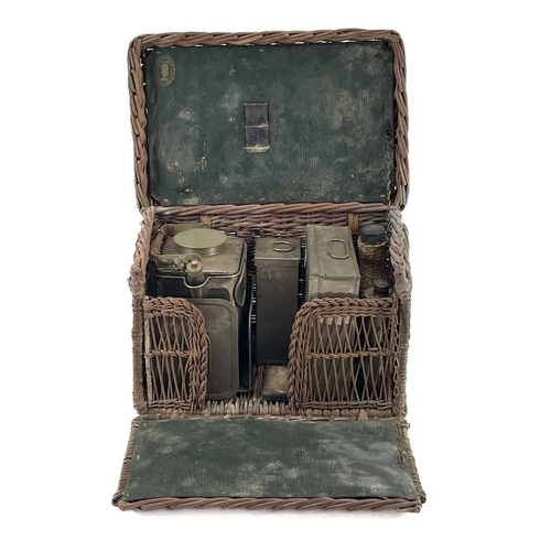 33 - A G.W Scott & Sons wicker picnic hamper. With pewter kettle paraffin burner, hip flask and pewter co... 