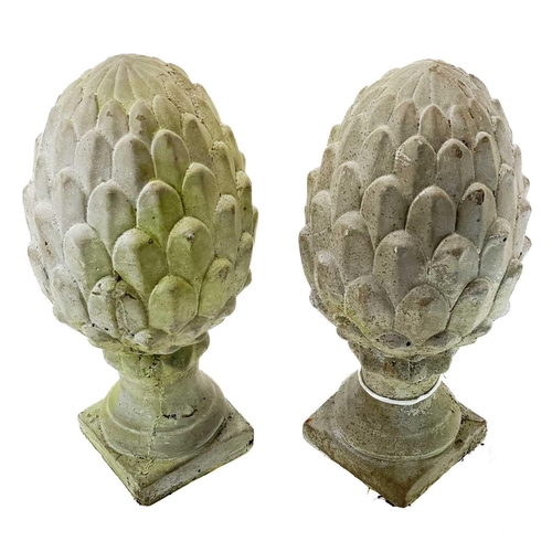 38 - A pair of concrete cone finials. Height 30cm, width 14cm, depth 14cm.General wear.