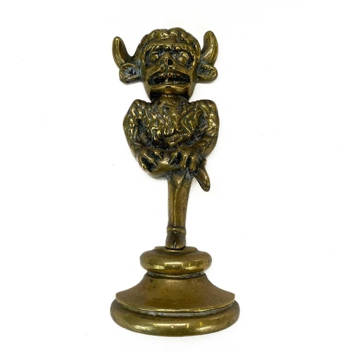 40 - A late Victorian brass Lincoln Imp door stop. Modelled standing on one leg with a plinth base, heigh... 