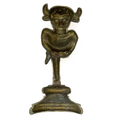 40 - A late Victorian brass Lincoln Imp door stop. Modelled standing on one leg with a plinth base, heigh... 