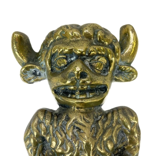 40 - A late Victorian brass Lincoln Imp door stop. Modelled standing on one leg with a plinth base, heigh... 