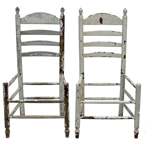 48 - A set of eight white-painted rush seated ladderback dining chairs. Late 19th century, with turned un... 