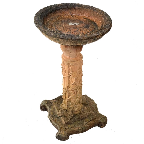 50 - A reconstituted stone bird bath. cast with foliate decoration, height 73cm, width 41cm, depth 41cm.