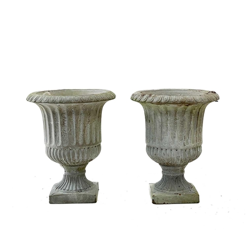 57 - A pair of reconstituted stone garden urns. Height 32cm, width 25cm, depth 25cm.