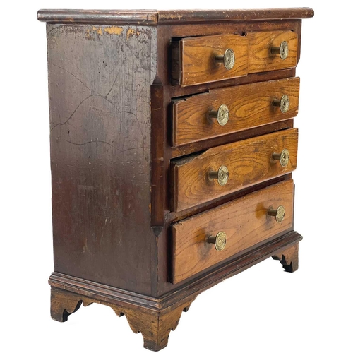 72 - A 19th elm small chest or collector's cabinet. 19th century, fitted with two short and three long dr... 